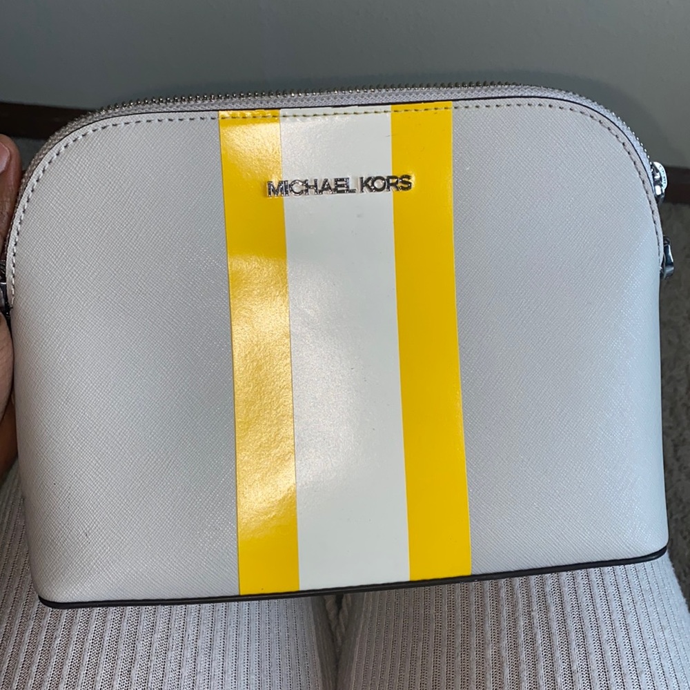 Gray and yellow crossbody Micheal Kors bag.